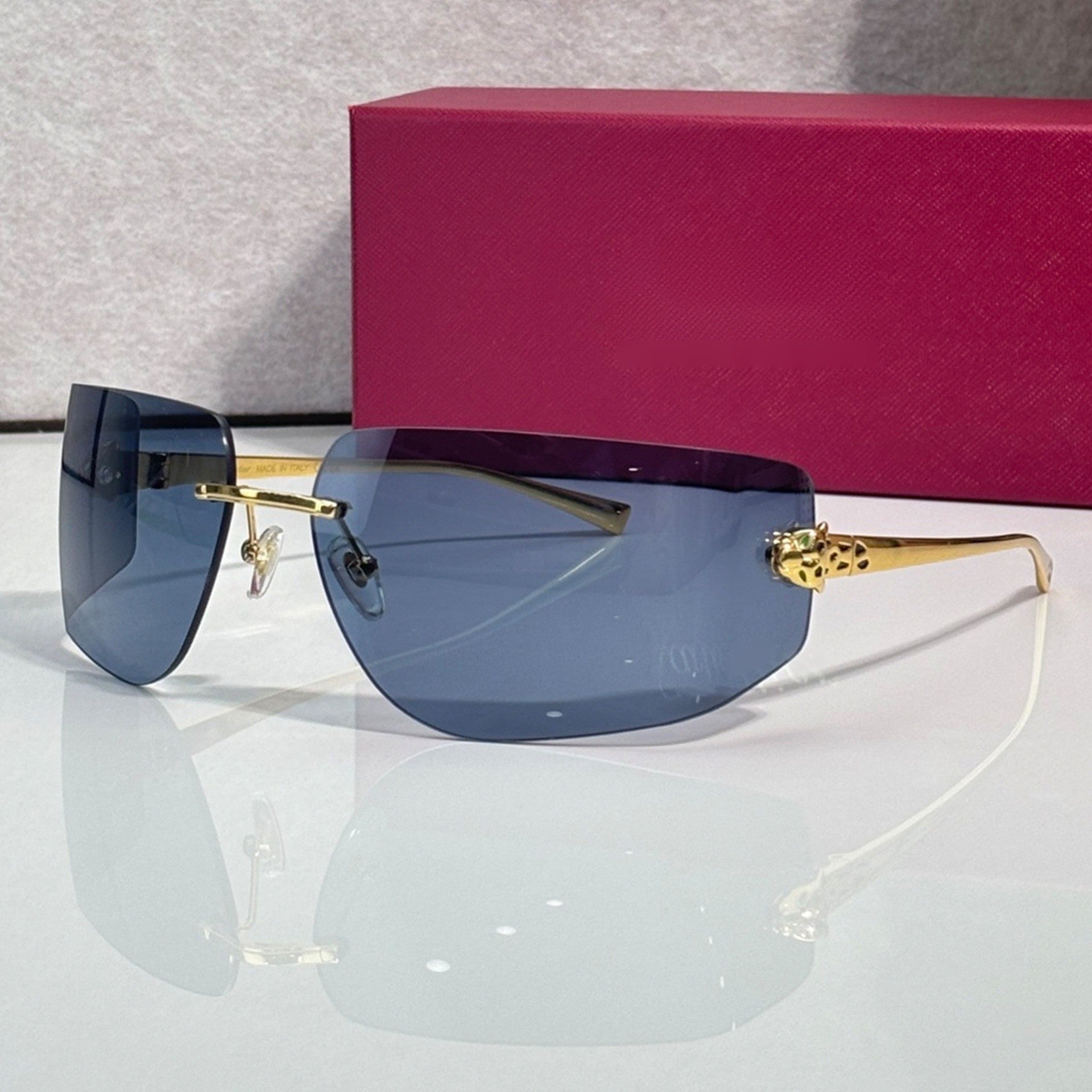 Panther Glasses, solid blue lenses, Cartier eyewear
